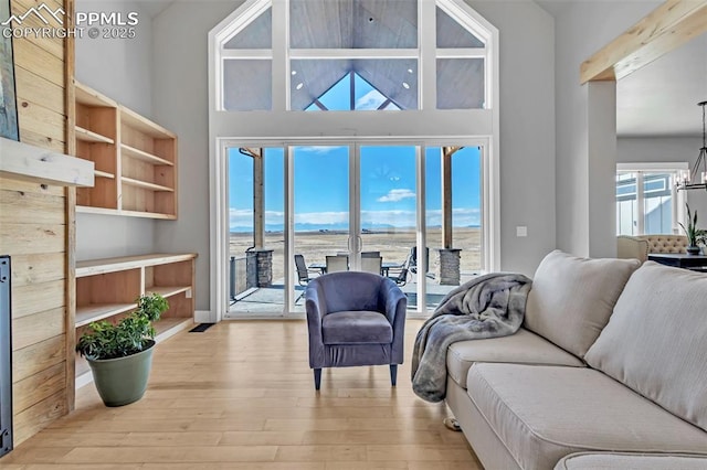 living room with a water view and light wood-type flooring