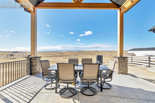 view of patio / terrace with a rural view