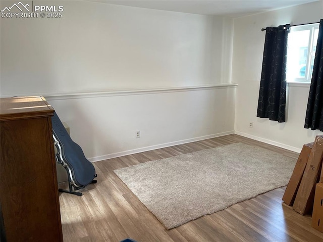 unfurnished bedroom featuring hardwood / wood-style flooring