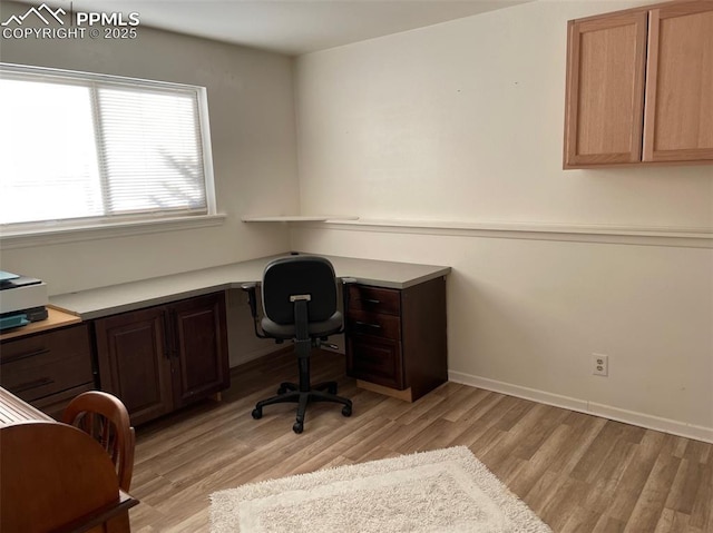 home office with light wood-type flooring