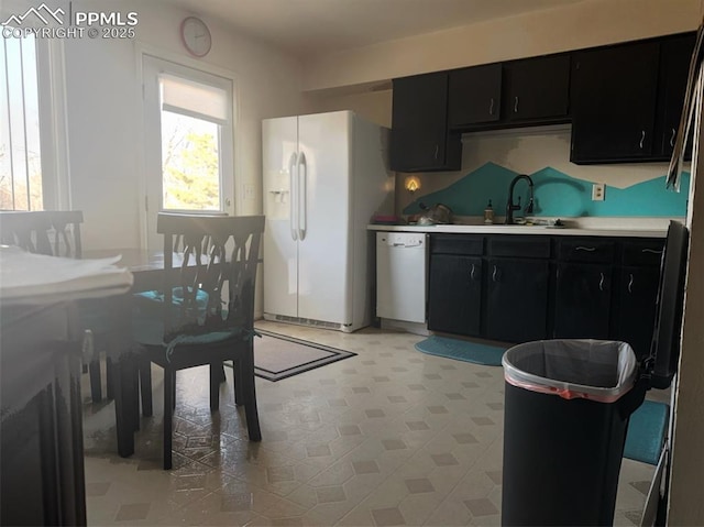 kitchen with sink and white appliances