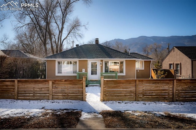 bungalow-style home featuring a mountain view