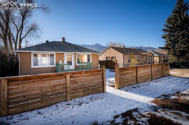 view of front facade featuring a mountain view