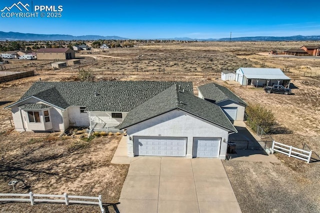 birds eye view of property featuring a mountain view