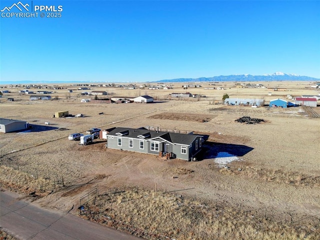 drone / aerial view with a rural view and a mountain view