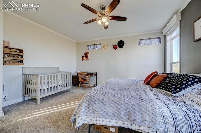 carpeted bedroom featuring ornamental molding and ceiling fan