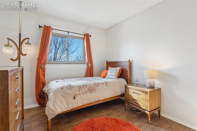 bedroom featuring dark hardwood / wood-style flooring