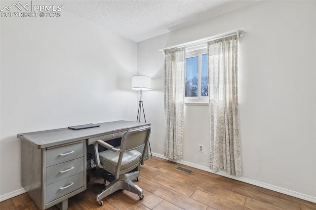 home office with a textured ceiling