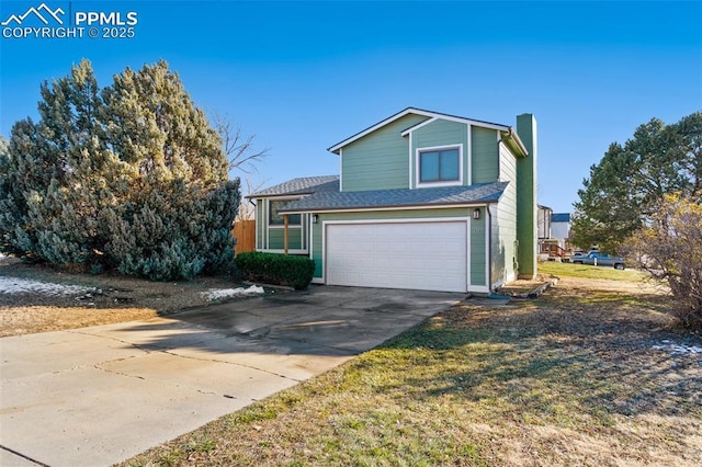 view of front property with a garage and a front yard