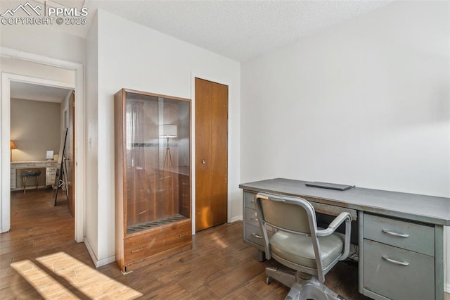 office featuring a textured ceiling and dark hardwood / wood-style flooring