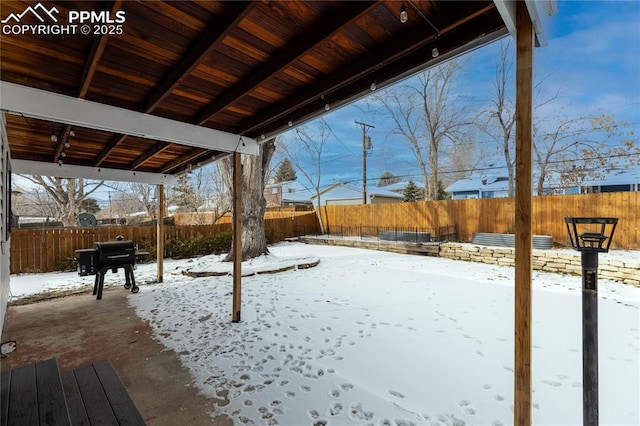 view of yard layered in snow