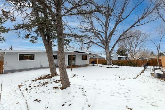 view of snow covered property