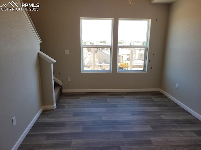 unfurnished room featuring dark hardwood / wood-style flooring