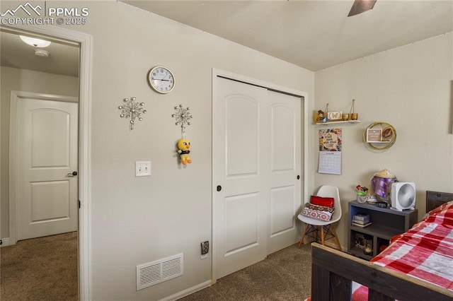 bedroom with ceiling fan, a closet, and dark carpet