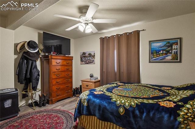 bedroom featuring ceiling fan and light hardwood / wood-style flooring