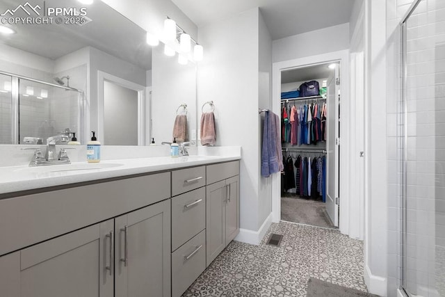 bathroom with an enclosed shower and vanity