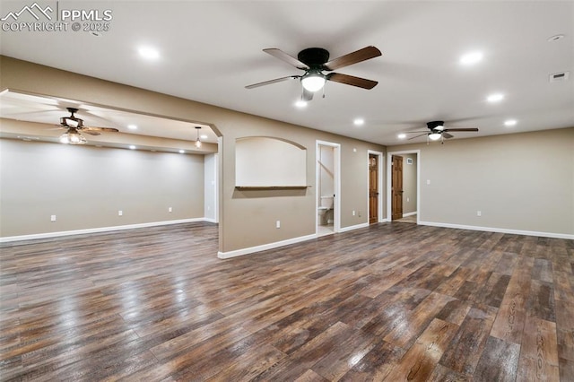 unfurnished living room with dark hardwood / wood-style flooring