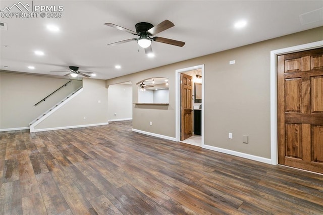 unfurnished living room with dark hardwood / wood-style floors