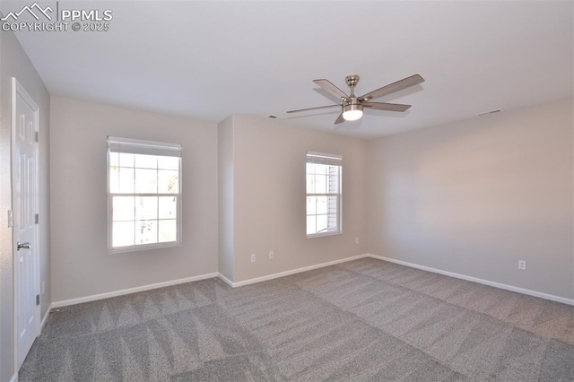 unfurnished room with carpet floors, plenty of natural light, and ceiling fan