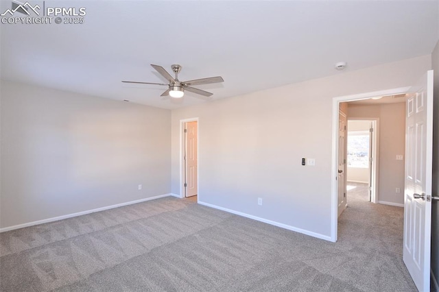 spare room featuring ceiling fan and light colored carpet