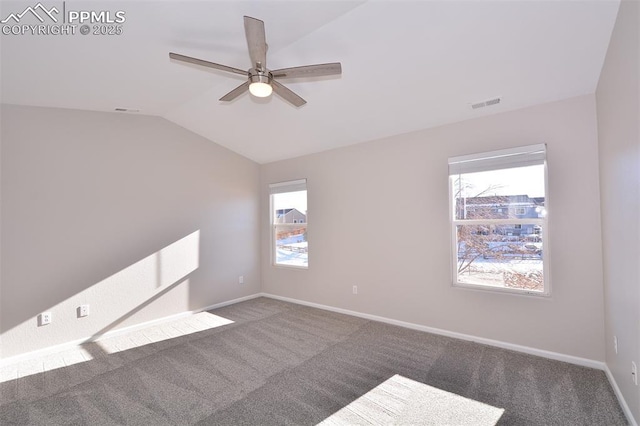 carpeted spare room with lofted ceiling and ceiling fan