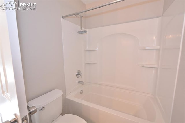 bathroom with toilet and shower / washtub combination