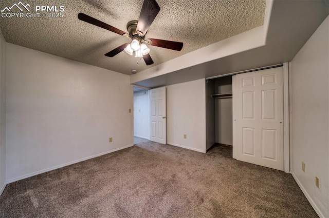 unfurnished bedroom with ceiling fan, a closet, carpet, and a textured ceiling