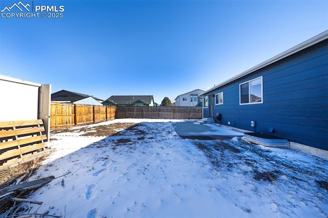 view of yard covered in snow