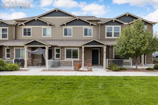 craftsman-style home with a front yard and a porch