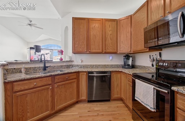 kitchen with sink, dishwashing machine, light wood-type flooring, light stone countertops, and black range with electric stovetop