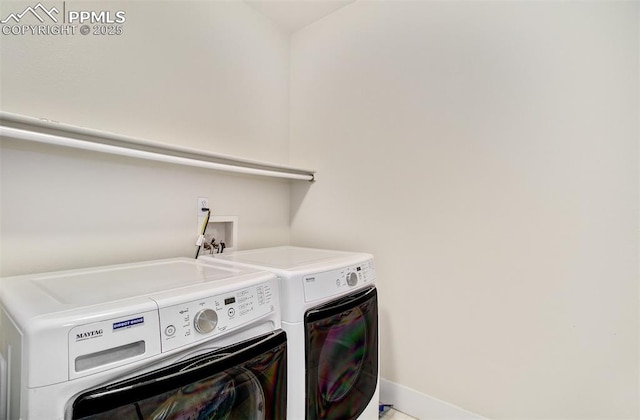 laundry room with separate washer and dryer