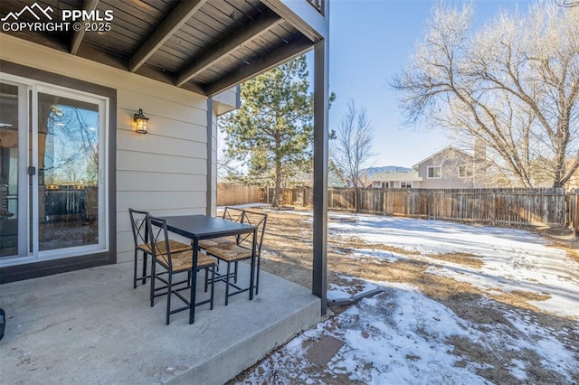 view of snow covered patio