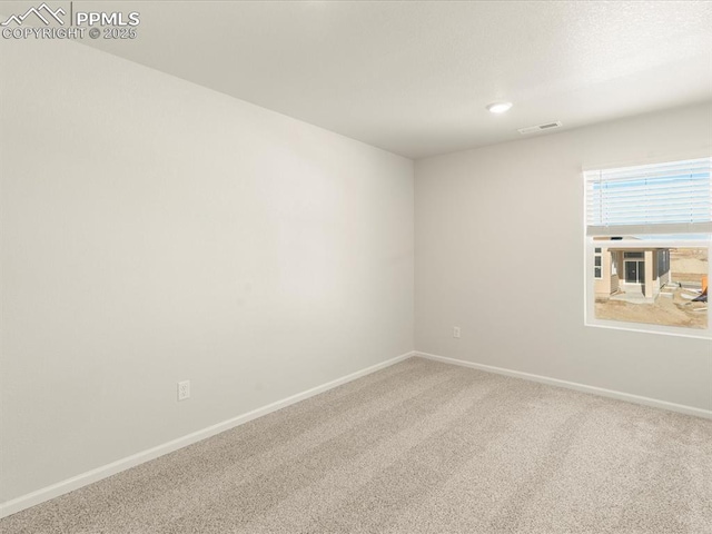 unfurnished room featuring carpet floors