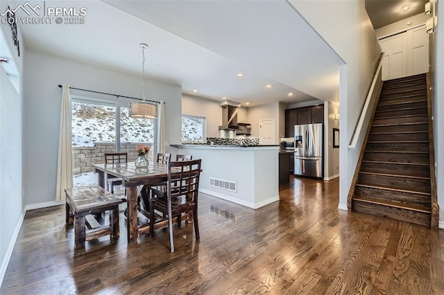 dining room with dark wood-type flooring