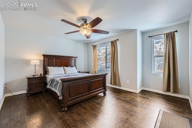 bedroom with ceiling fan, dark hardwood / wood-style floors, and multiple windows