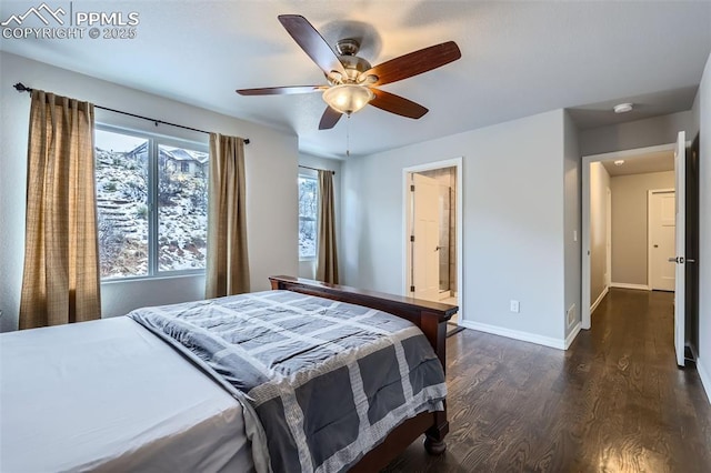 bedroom with ceiling fan, connected bathroom, and dark hardwood / wood-style floors