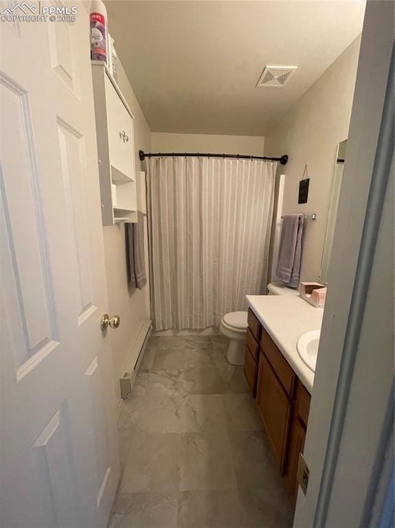 bathroom featuring toilet, baseboard heating, a shower with shower curtain, and vanity