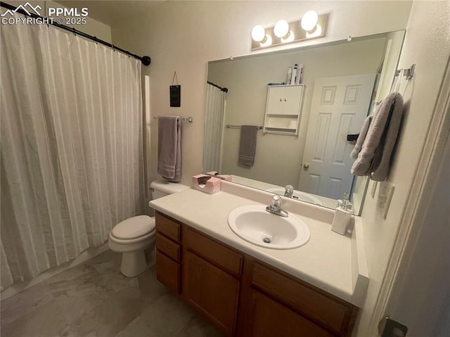 bathroom with toilet and vanity