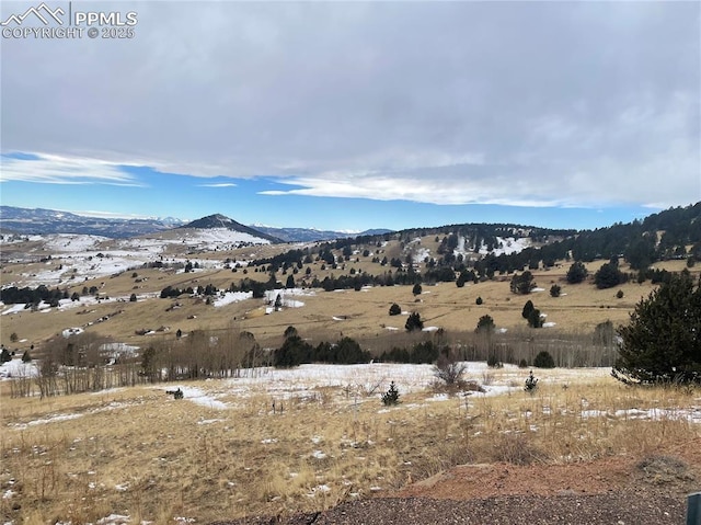 property view of mountains featuring a rural view