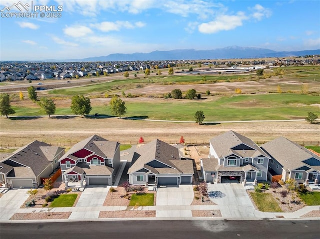 birds eye view of property with a mountain view