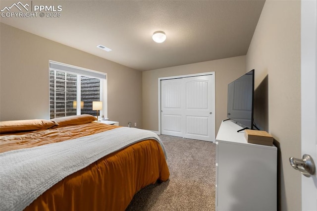 bedroom with a closet and carpet flooring