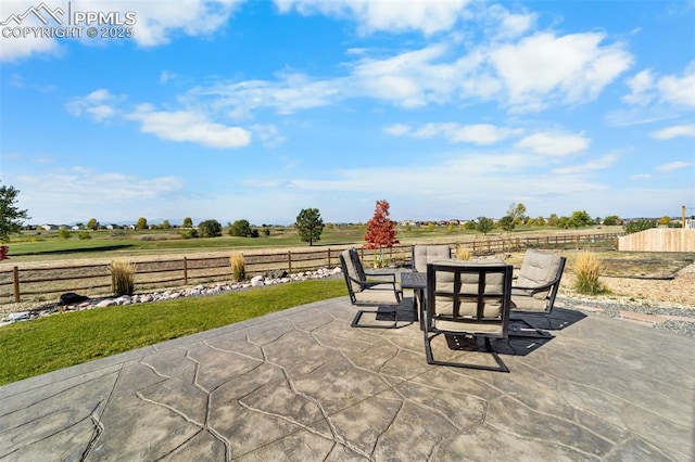 view of patio / terrace featuring a rural view