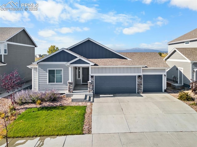 view of front of property with a front yard and a garage