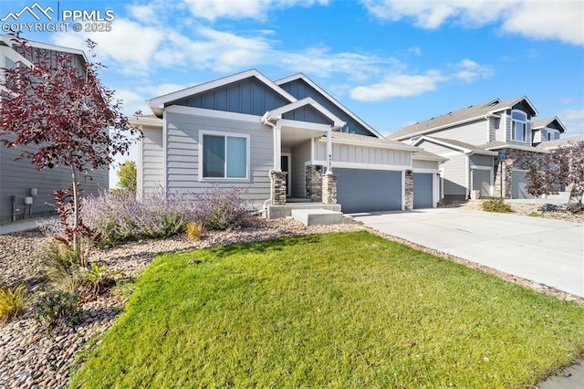 craftsman-style home featuring a front yard and a garage