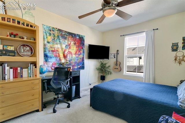 bedroom with ceiling fan and light carpet