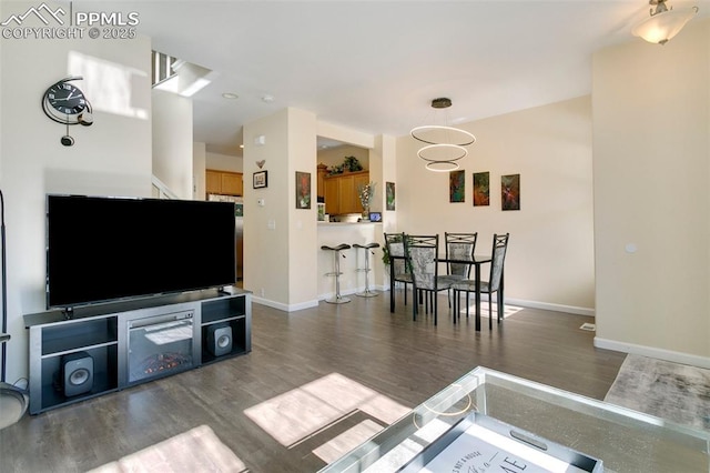 living room featuring dark hardwood / wood-style flooring and a notable chandelier