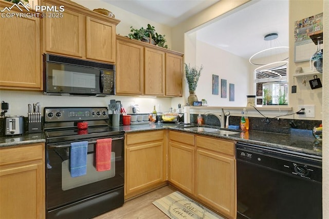 kitchen featuring light hardwood / wood-style floors, sink, dark stone counters, and black appliances