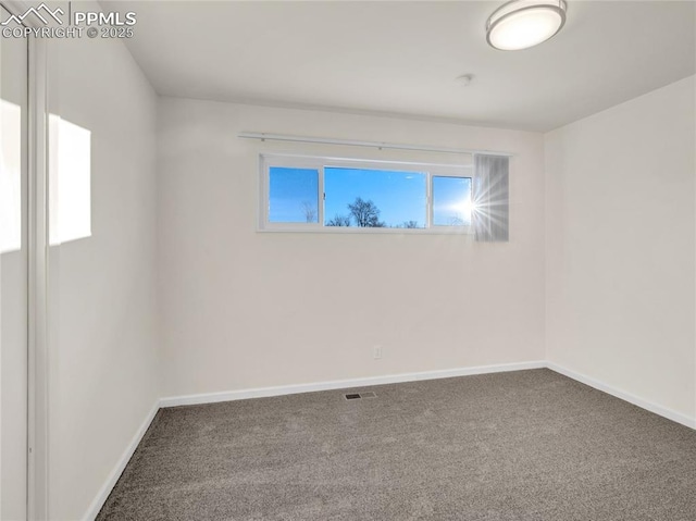 spare room with carpet flooring