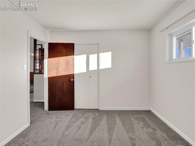 unfurnished room with light colored carpet