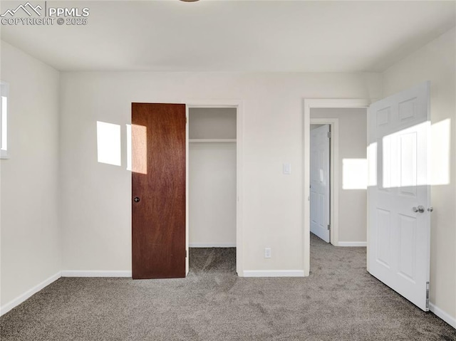 unfurnished bedroom featuring a closet and light carpet